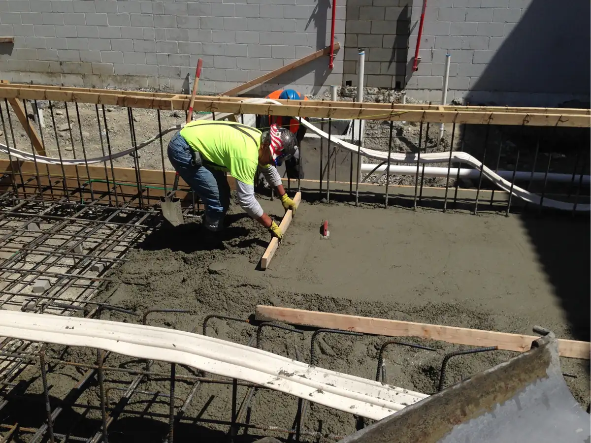 Placing structural concrete over rebar and conduit