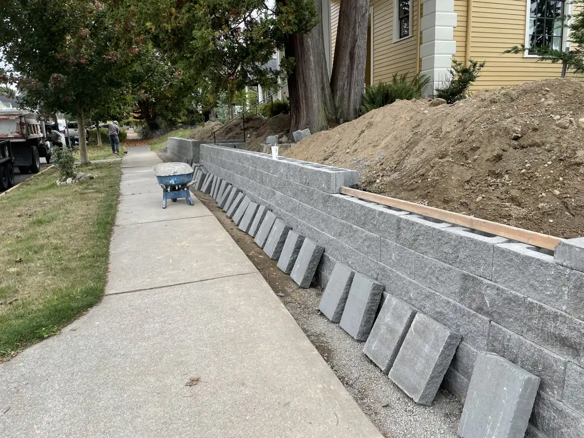 Long run of block wall with cap stones ready to set