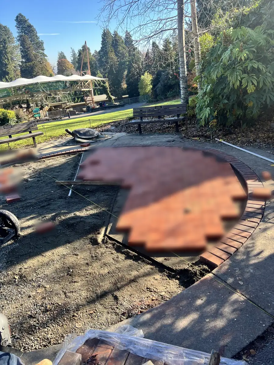 Memorial paver field half-installed (engravings blurred for privacy)