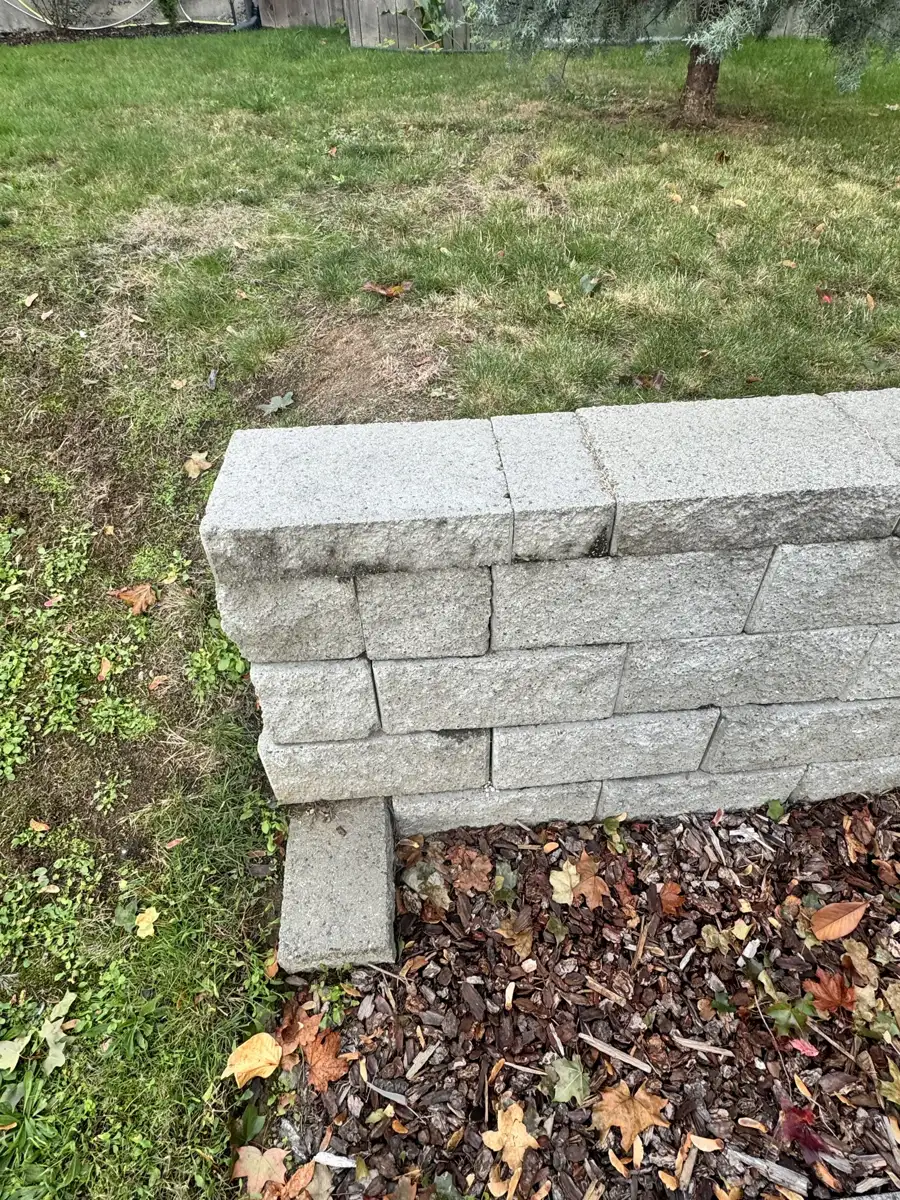 Finished wall end with cap stones installed