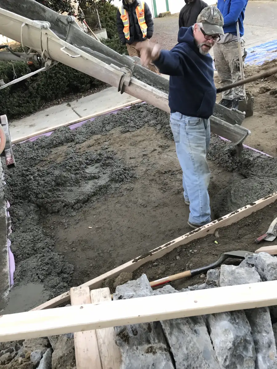 Placing concrete for a new walkway