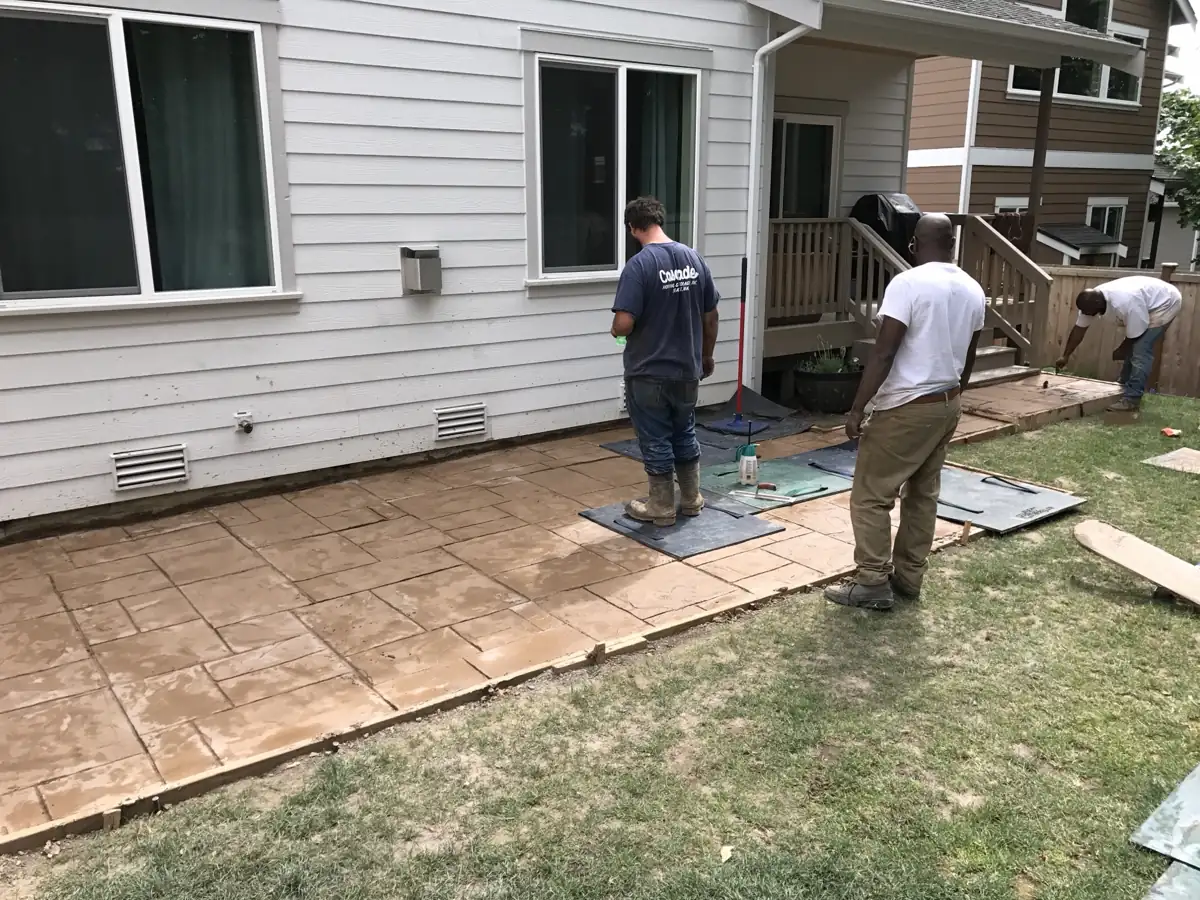 HULK crew stamping a decorative concrete patio