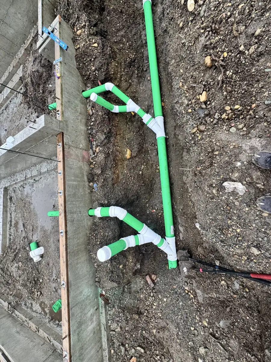 New water and drain lines run before backfill