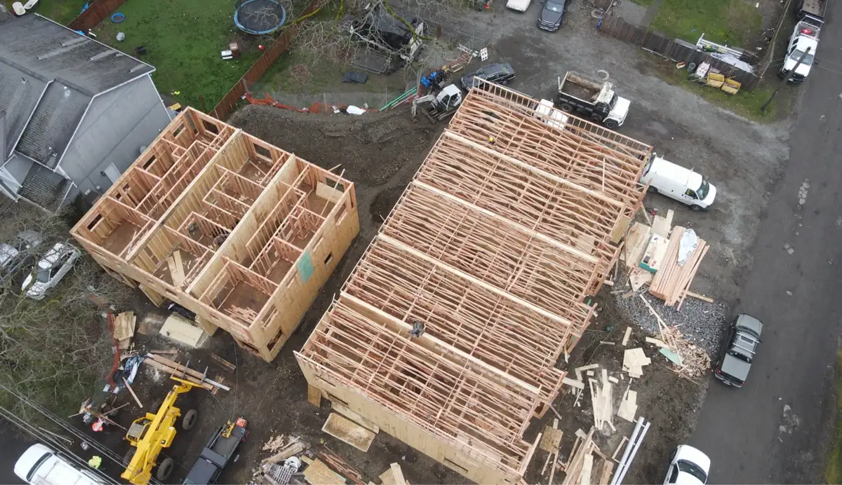 Prospect Townhomes: aerial view of the five-plex and three-plex during framing