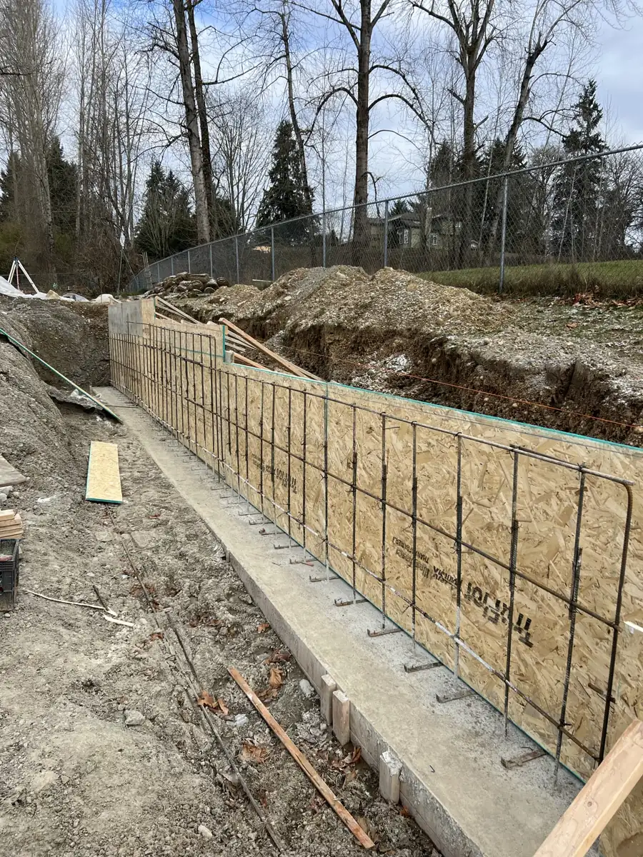 Forming a cast-in-place retaining wall