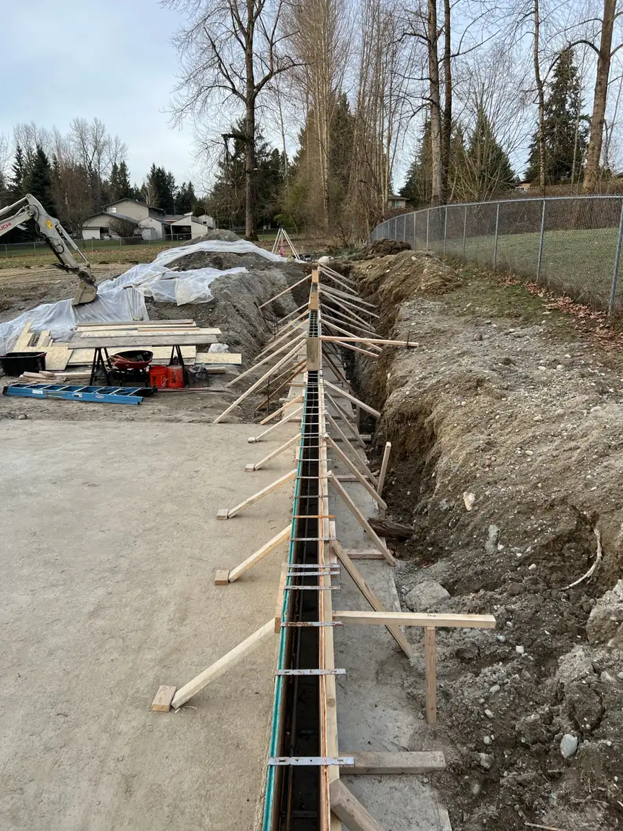 Retaining wall forms braced and ready for concrete